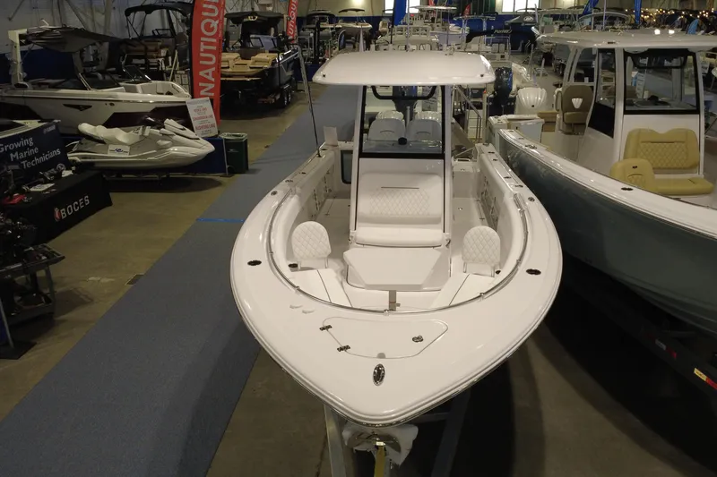 Slide: The Image of 2026 Sportsman Open 252 Center Console boat displayed at a marine exhibition. - 8