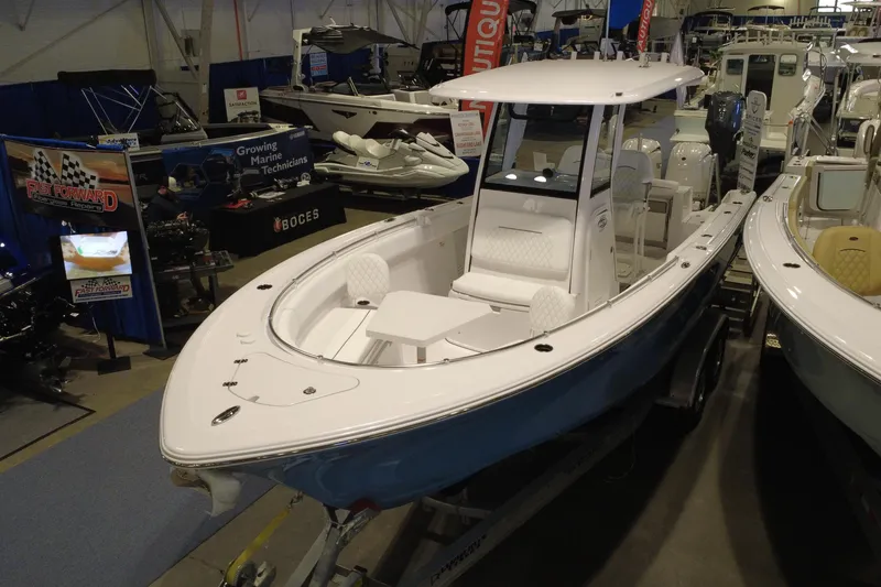 Slide: The Image of 2026 Sportsman Open 252 Center Console boat displayed at an indoor exhibition. - 9