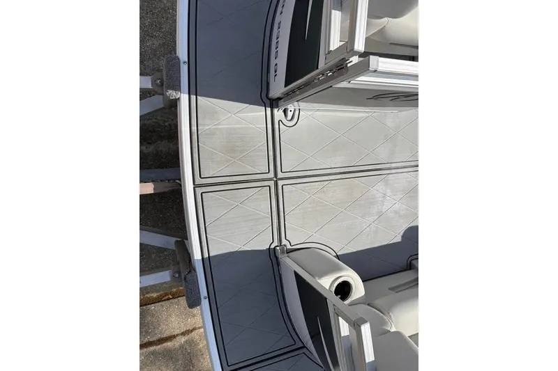 Slide: The Image of 2023 Avalon Venture 85 Quad Lounge boat deck with sleek, modern design and seating. - 7