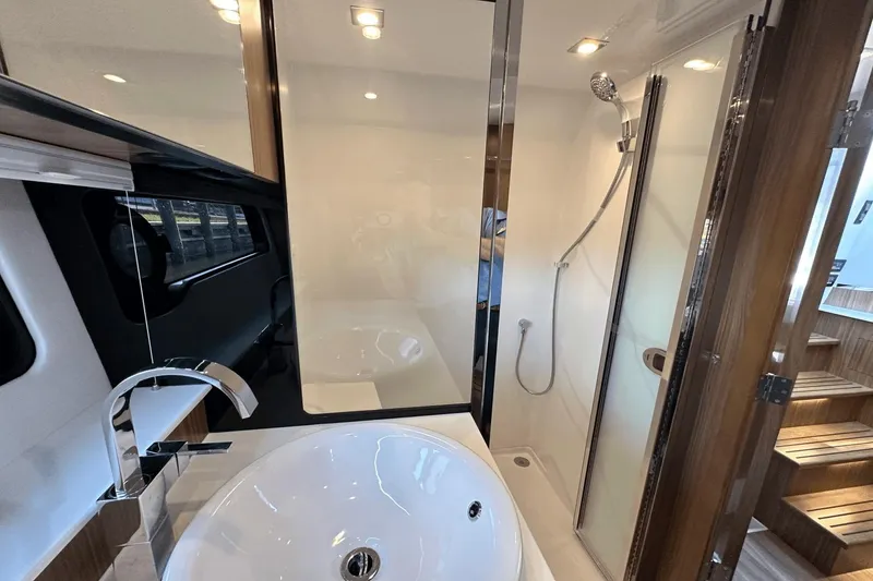 Slide: The Image of Luxurious bathroom interior of 2024 Cruisers Yachts 50 GLS with modern fixtures. - 13