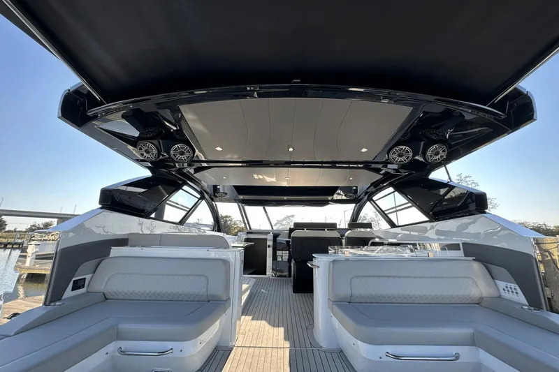 Slide: The Image of 2024 Cruisers Yachts 50 GLS luxury interior with sleek design and spacious seating. - 16