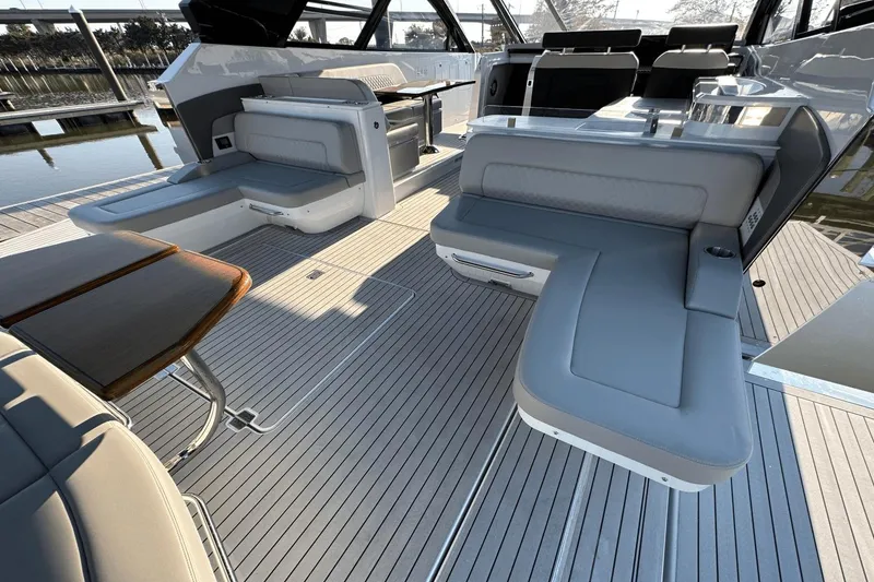 Slide: The Image of 2024 Cruisers Yachts 50 GLS interior with luxurious seating and sleek design. - 19