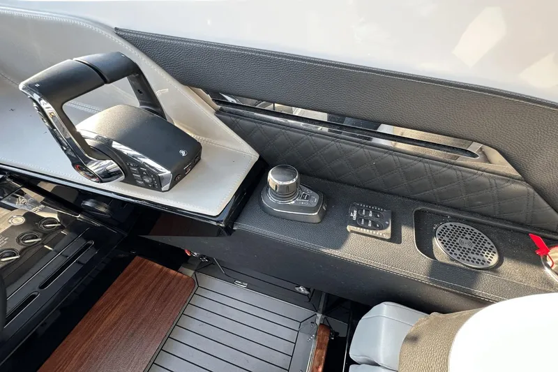 Slide: The Image of 2024 Cruisers Yachts 50 GLS helm controls with modern dashboard and sleek design. - 22