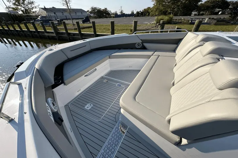 Slide: The Image of 2024 Cruisers Yachts 50 GLS luxury boat interior with spacious seating and elegant design. - 27