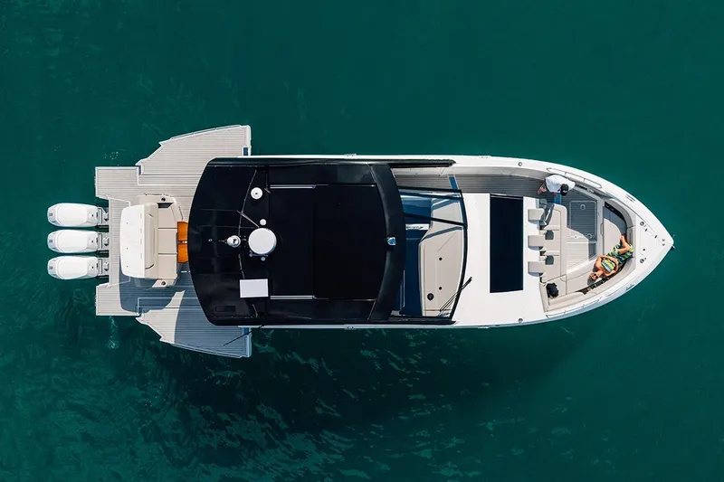 Slide: The Image of Aerial view of 2024 Cruisers Yachts 50 GLS on clear blue water. - 3