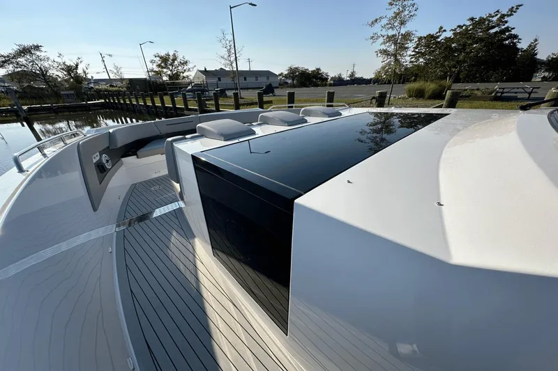 Slide: The Image of 2024 Cruisers Yachts 50 GLS luxury boat deck with sleek design and modern features. - 38