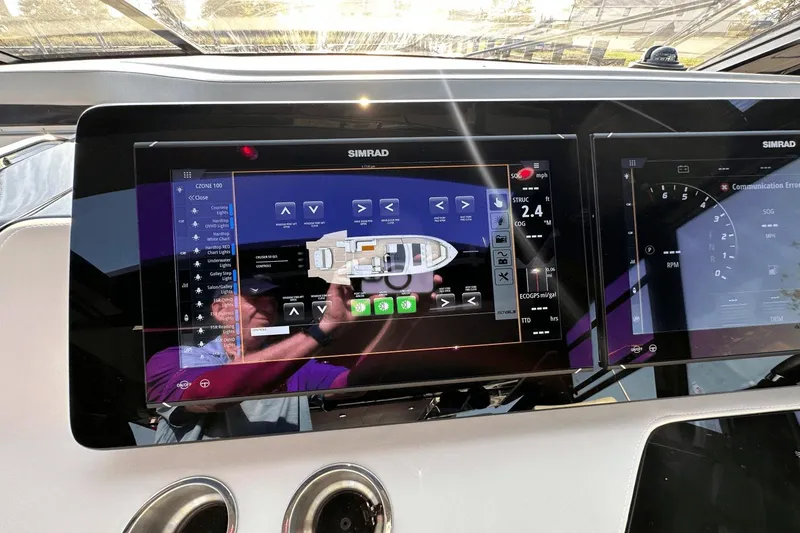 Slide: The Image of Simrad navigation display on 2024 Cruisers Yachts 50 GLS dashboard. - 53