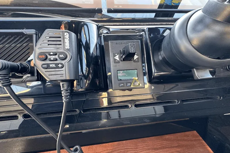 Slide: The Image of Control panel of 2024 Cruisers Yachts 50 GLS with Simrad radio and Side-Power joystick. - 54