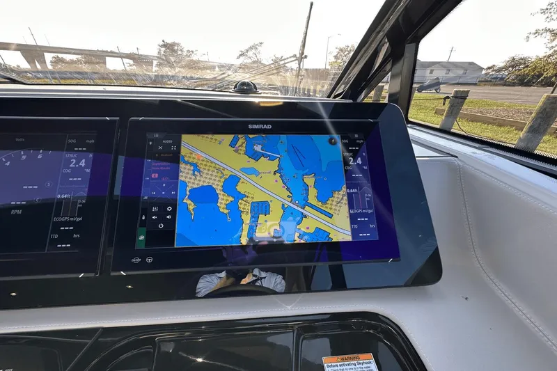 Slide: The Image of Dashboard of 2024 Cruisers Yachts 50 GLS with navigation display. - 55