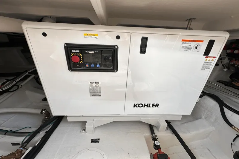Slide: The Image of Kohler generator in 2024 Cruisers Yachts 50 GLS engine room. - 57