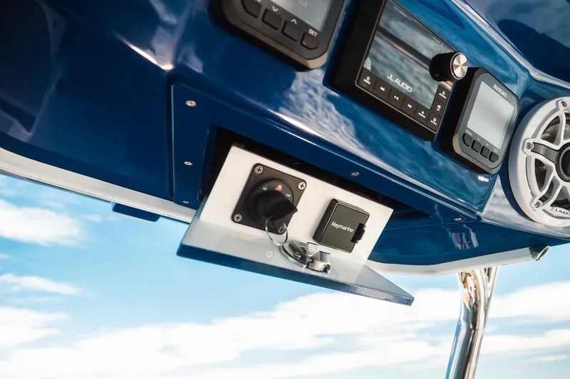 Slide: The Image of Control panel of Dynamic D-305V boat, featuring audio system and navigation equipment, 2023 model. - 15