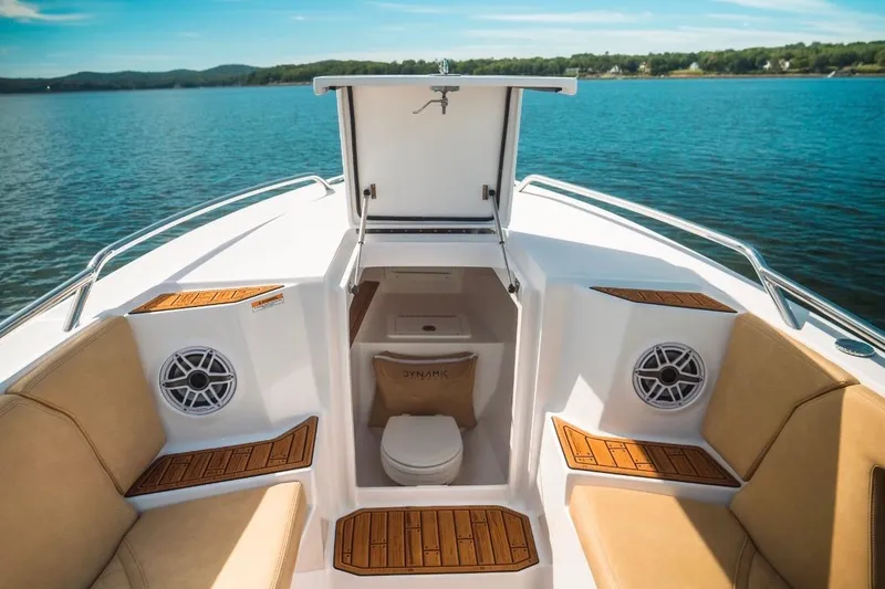 Slide: The Image of Luxurious 2023 Dynamic D-305V boat interior with seating and open storage compartment. - 21