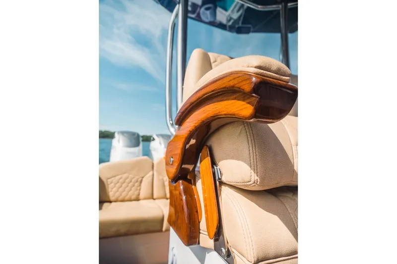 Slide: The Image of Luxurious boat seating with polished wood accents on a Dynamic D-305V, 2023 model. - 25