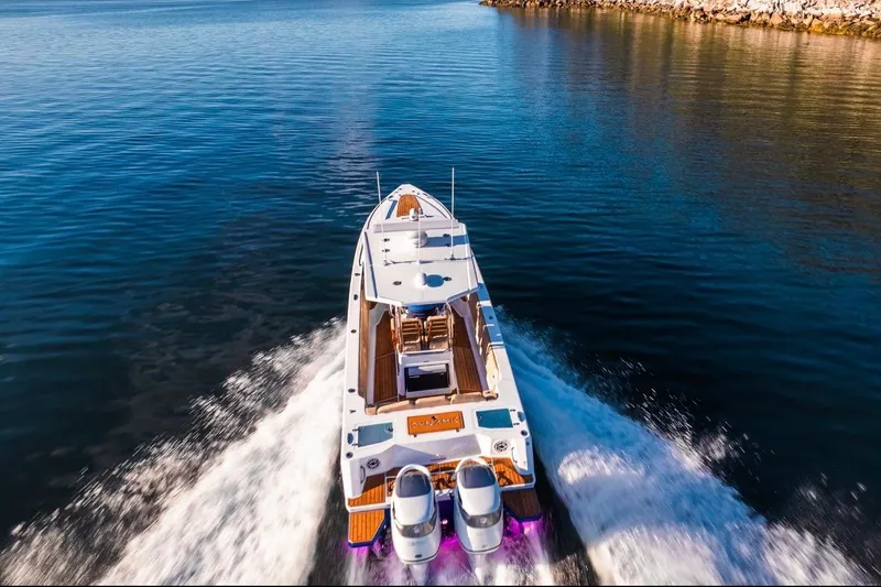 Slide: The Image of Aerial view of Dynamic D-305V boat cruising on calm water, 2023 model. - 3