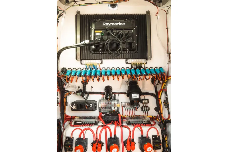 Slide: The Image of Electrical panel with Raymarine equipment, Dynamic D-305V model, 2023, featuring organized wiring and components. - 30