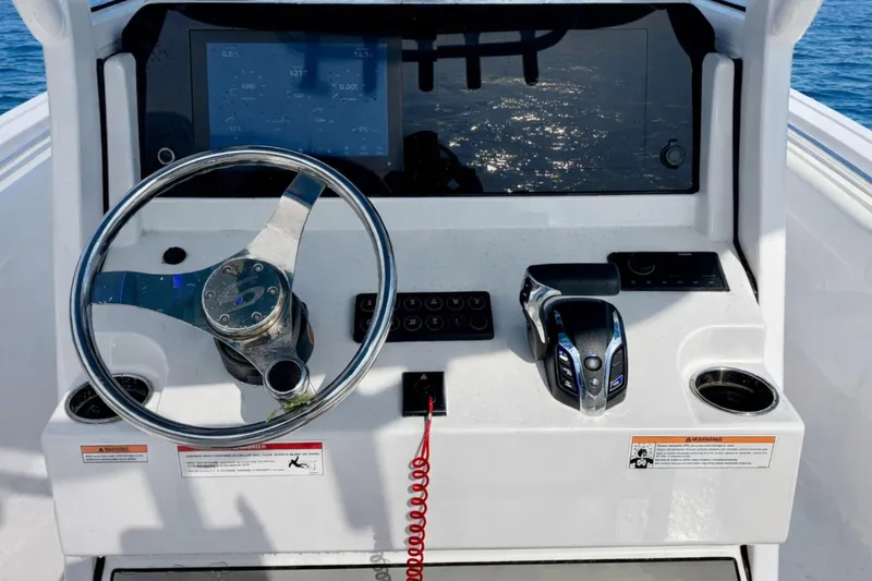 Slide: The Image of 2024 Sportsman Heritage 231 Center Console fishing rod storage on deck. - 12