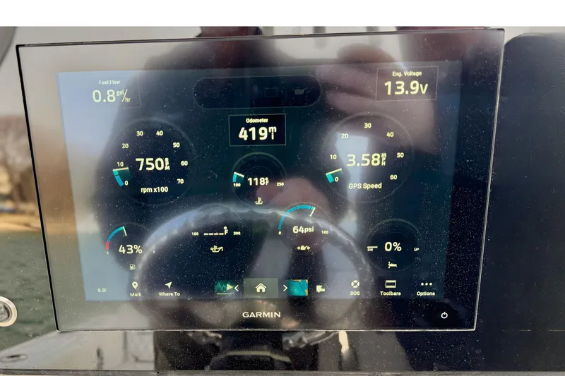 Slide: The Image of 2024 Sportsman Heritage 231 Center Console dashboard with steering wheel and controls. - 13