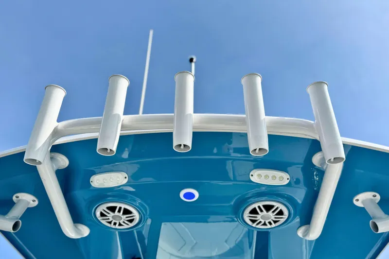 Slide: The Image of Control panel of 2024 Sportsman Heritage 231 Center Console boat with throttle and buttons. - 15