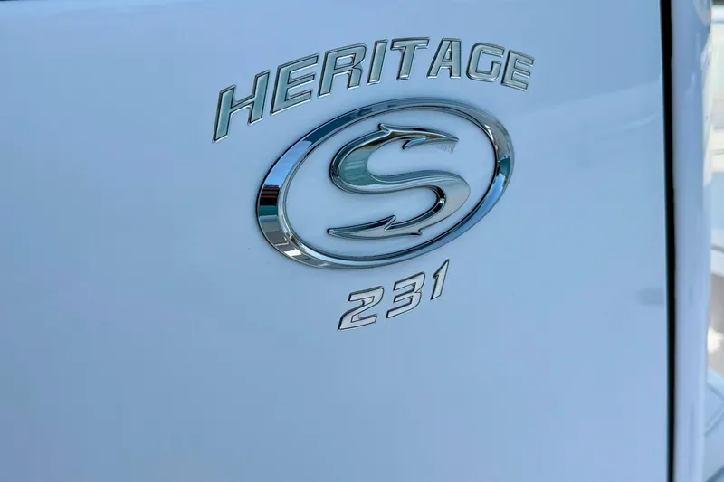 Slide: The Image of Garmin marine radio on 2024 Sportsman Heritage 231 Center Console boat dashboard. - 18