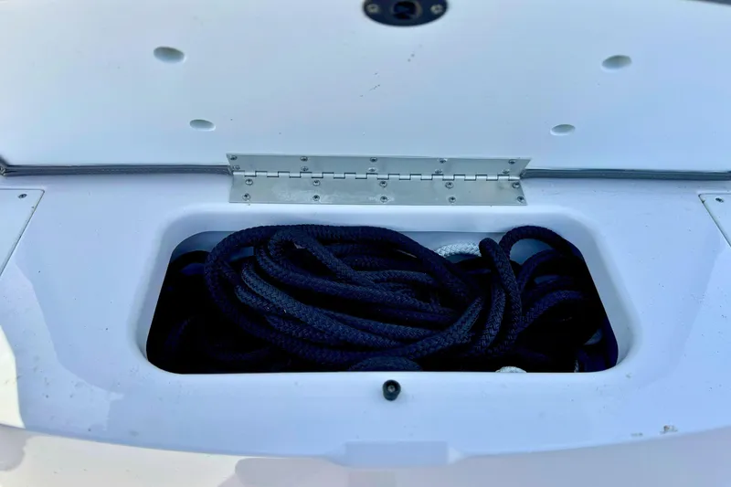 Slide: The Image of 2024 Sportsman Heritage 231 Center Console boat seat, white upholstery, diamond stitching. - 22