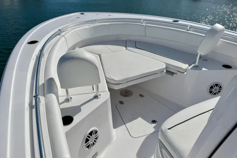 Slide: The Image of 2024 Sportsman Heritage 231 Center Console storage compartment with coiled rope. - 23