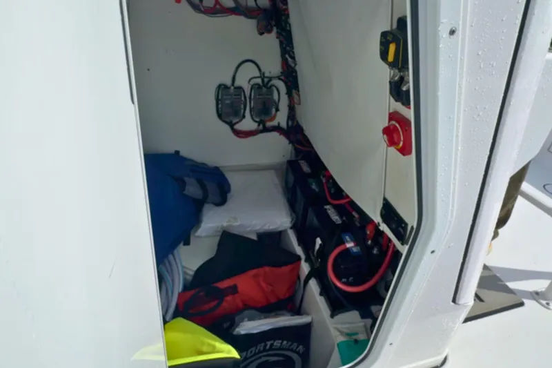 Slide: The Image of 2024 Sportsman Heritage 231 Center Console boat interior, showcasing sleek design and storage features. - 25