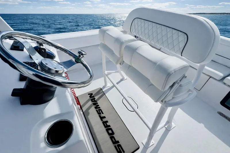 Slide: The Image of Interior storage of 2024 Sportsman Heritage 231 Center Console boat, showing equipment and wiring. - 26