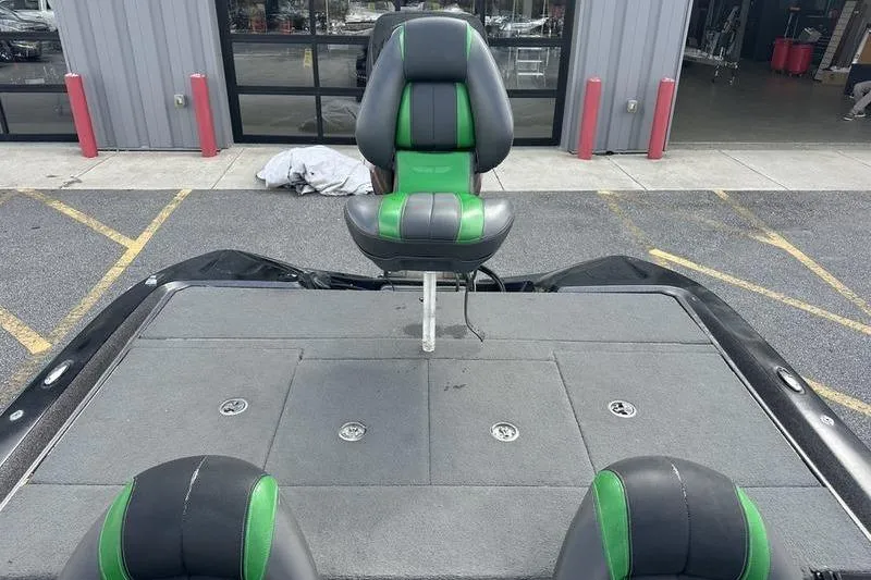 Slide: The Image of 2016 Stratos 294 XL Evolution boat interior with green and black seating. - 3