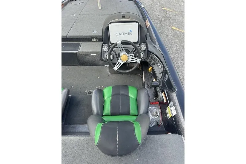 Slide: The Image of 2016 Stratos 294 XL Evolution boat cockpit with Garmin navigation system and green-black seat. - 6