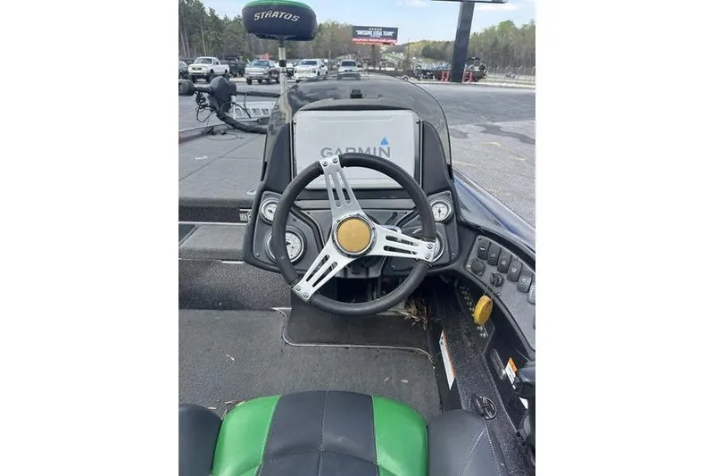 Slide: The Image of 2016 Stratos 294 XL Evolution boat cockpit with Garmin navigation system. - 8
