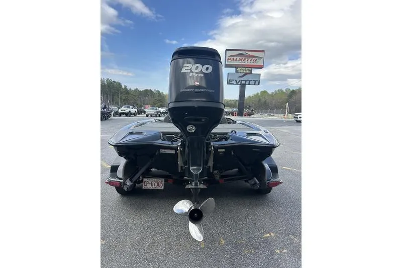 Slide: The Image of 2016 Stratos 294 XL Evolution boat with 200 Pro motor in parking lot. - 9
