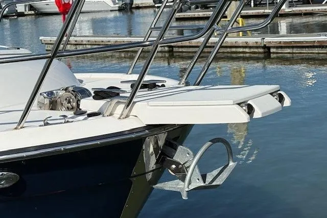 Slide: The Image of 2019 Cutwater 28 boat with anchor and bow platform at marina. - 21