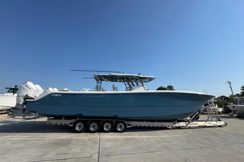 The Image of 2024 Invincible 46 Catamaran on trailer under clear blue sky. - 1