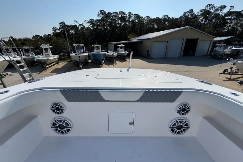 Slide: The Image of 2024 Invincible 46 Catamaran at a boatyard, showcasing deck and storage features. - 17