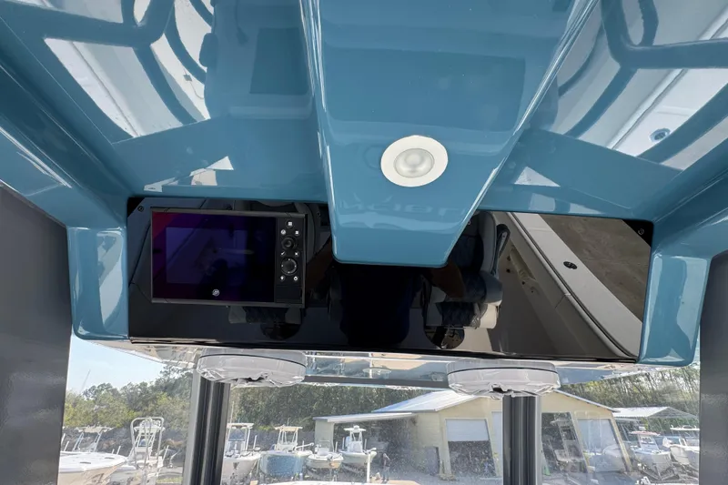 Slide: The Image of 2024 Invincible 46 Catamaran helm with modern navigation display and sleek design. - 29