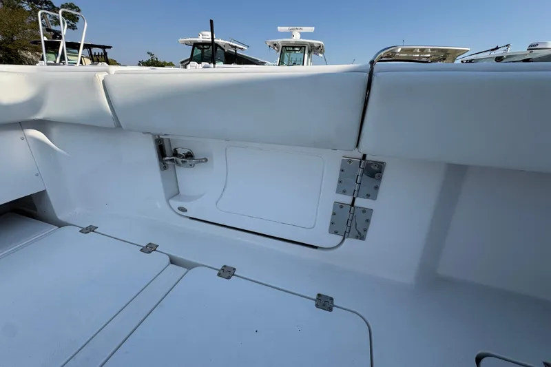 Slide: The Image of 2024 Invincible 46 Catamaran interior detail with storage compartment and seating. - 35