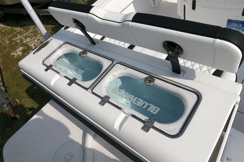 Slide: The Image of 2026 Bluewater Sportfishing 25T boat with dual livewells and cushioned seating. - 12
