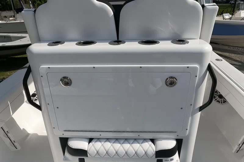 Slide: The Image of 2026 Bluewater Sportfishing 25T boat console with seating and storage compartments. - 14