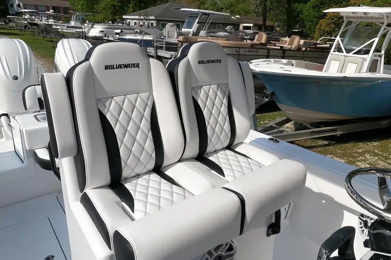 Slide: The Image of 2026 Bluewater Sportfishing 25T boat with luxurious white and black seating. - 16