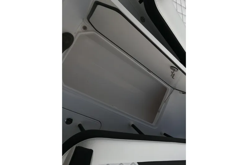 Slide: The Image of Open storage compartment on 2026 Bluewater Sportfishing 25T boat, showcasing interior space. - 20
