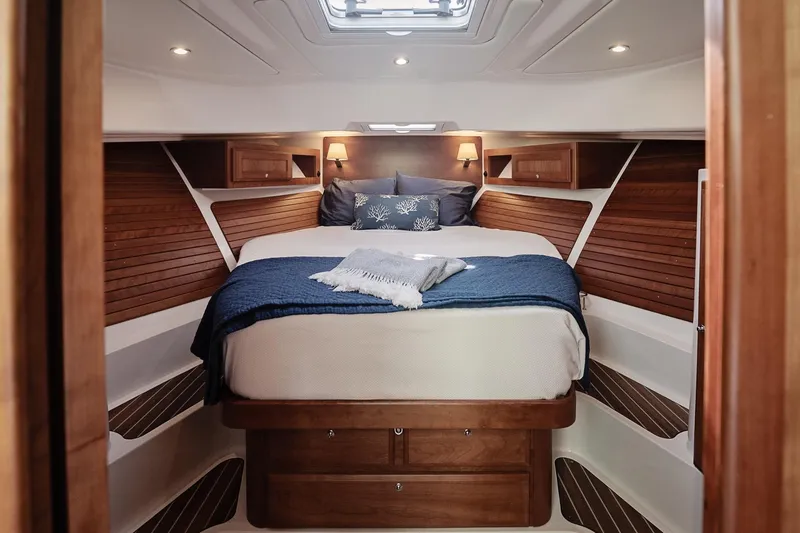 Slide: The Image of Luxurious cabin interior of 2023 Back Cove 39O yacht with cozy bed and elegant wood finish. - 11