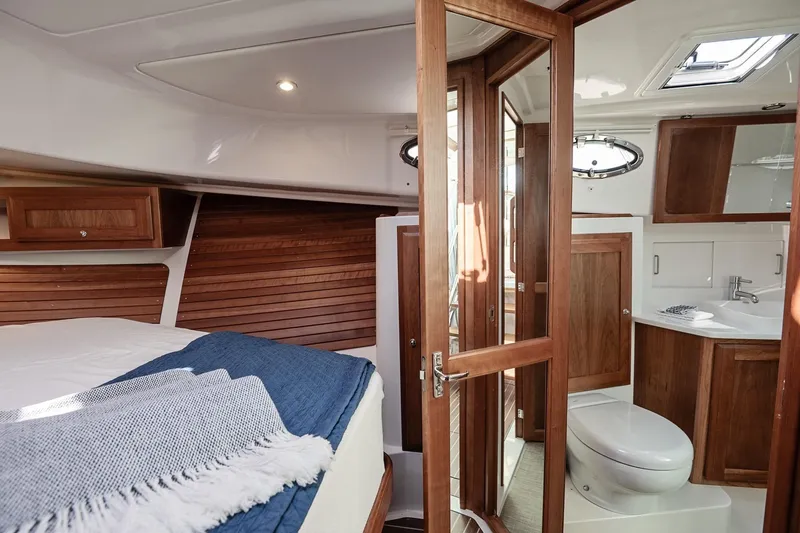 Slide: The Image of Luxurious 2023 Back Cove 39O yacht interior with wood accents and modern amenities. - 12