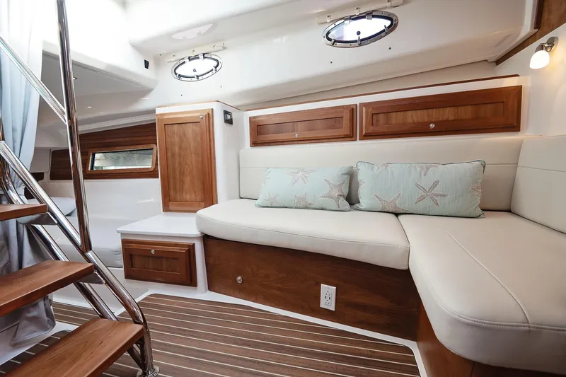 Slide: The Image of Luxurious interior of 2023 Back Cove 39O yacht with elegant wood finishes and comfortable seating. - 16