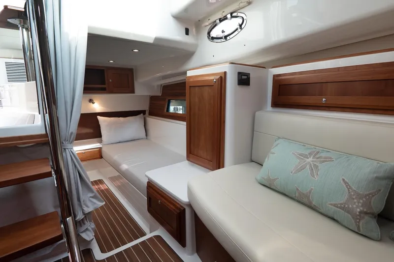 Slide: The Image of Luxurious interior of 2023 Back Cove 39O yacht with elegant wood finishes and cozy seating. - 19