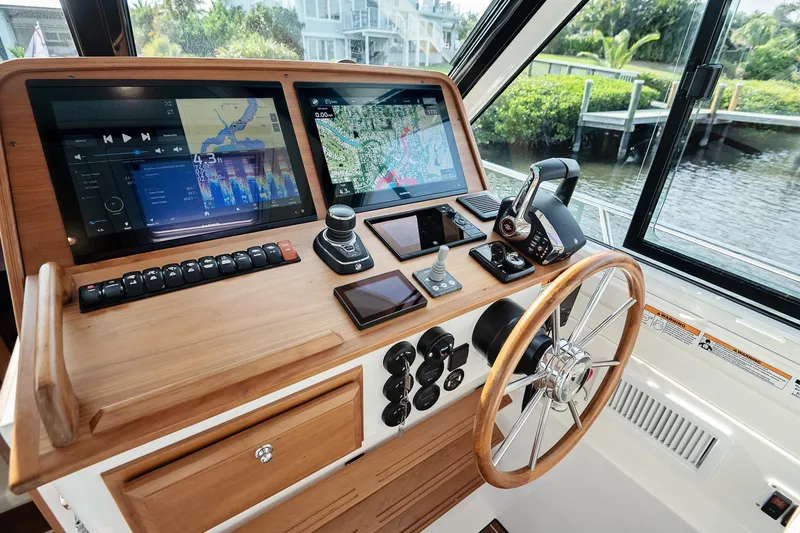 Slide: The Image of Helm of 2023 Back Cove 39O boat with advanced navigation and control systems. - 23