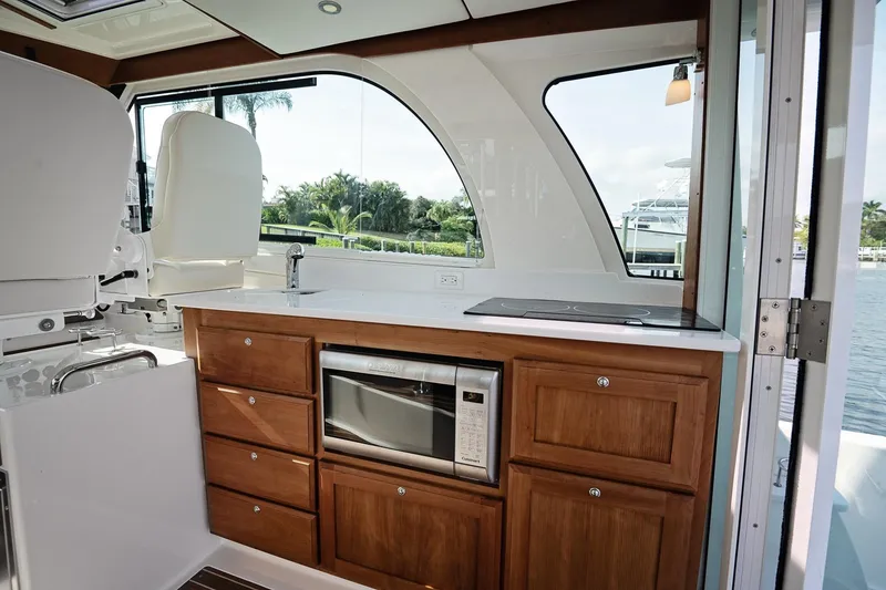 Slide: The Image of Luxurious 2023 Back Cove 39O yacht interior with modern kitchen and scenic water view. - 26