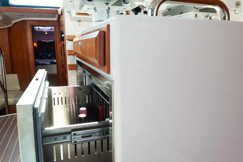 Slide: The Image of 2023 Back Cove 39O yacht interior with open drawer refrigerator. - 30