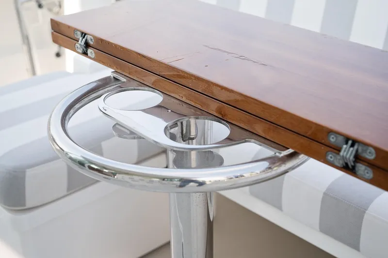 Slide: The Image of 2023 Back Cove 39O boat table with wooden top and chrome base. - 51
