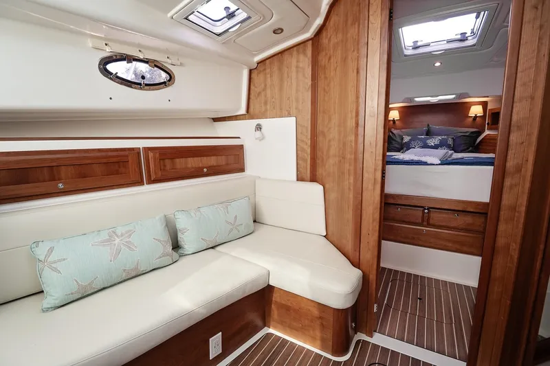 Slide: The Image of Luxurious interior of 2023 Back Cove 39O yacht with cozy seating and elegant wood finishes. - 9