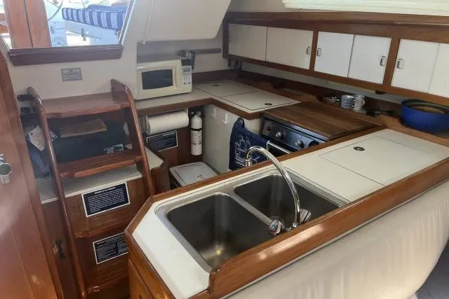 Slide: The Image of Interior of 1993 Catalina 36 MkII yacht with wooden flooring and Dometic control panel. - 10